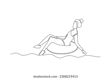 A woman sits on a ring buoy. Swimming in beach one-line drawing