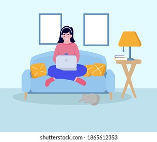 A woman sits on the sofa with a laptop on her lap and works or studies from home . Freelance Concept, Home Office, Remote Work, Online