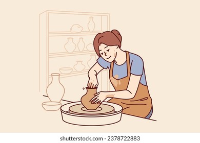 Woman sits in pottery workshop and sculpts jug from clay to sell handmade souvenirs in craft goods shop. Girl craftsman is interested in pottery art, dressed in apron stained with dirt.