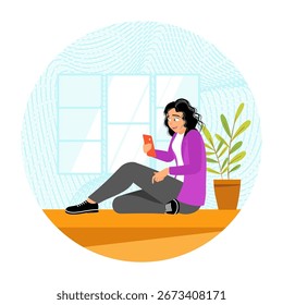 A woman sitting by a window and using a phone, looking content and relaxed. People using gadgets concept.