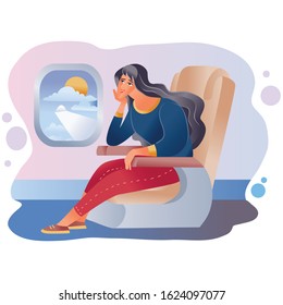 woman is sitting in the cabin of the plane and looking through the porthole in which you can see the wing of the plane and the sun with clouds,