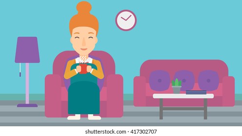 Woman sitting in chair with cup of tea.