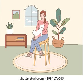 A woman is sitting in a chair holding a small puppy. House interior background. flat design style minimal vector illustration.