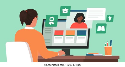 Woman sitting at desk and connecting with her computer, she is taking online classes, e-learning and online courses concept