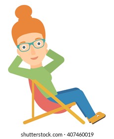 Woman sitting in a folding chair.