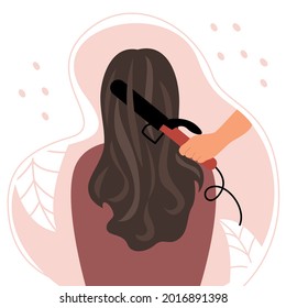The woman is sitting with her back with beautiful curly brown hair. Curling hair on a curling iron and care. Vector flat illustration.