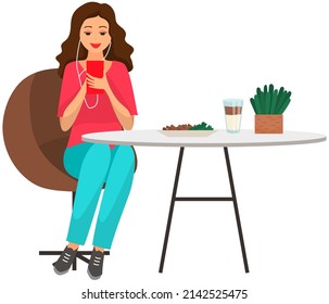 Woman sitting holds smartphone in her hand. Casual lady in headpones listening to music and browsing social media on mobile device. Girl on couch uses phone for chatting and surfing internet