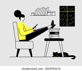 A woman is sitting at home on the couch and looking at a tablet, smartphone. Checks social networks. She stretched out her legs and put them on a stack of books. It's raining outside the window.