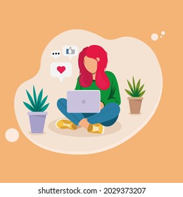 A woman is sitting at home and texting on a laptop. Blogger