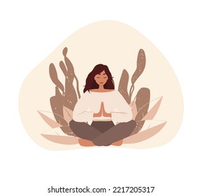 The woman is sitting in the lotus position, hands are connected. Woman doing reiki, spiritual healing concept. Woman in meditation. 