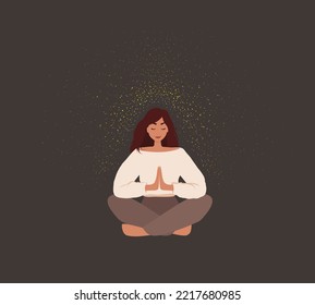 The woman is sitting in the lotus position, hands are connected. Woman doing reiki, spiritual healing concept. Woman in meditation. 