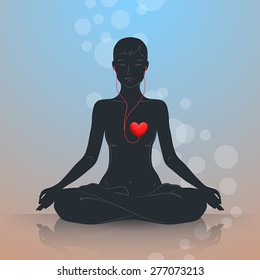 Woman is sitting in lotus position and meditating. Dark silhouette on blue-brown background. Listen to your heart and live in harmony