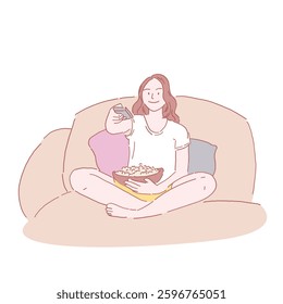 A woman sitting on a couch eating popcorn and pressing the remote control