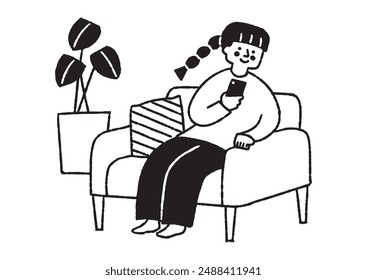 Woman sitting on sofa looking at her phone_2