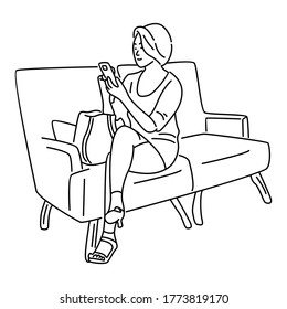 Woman sitting on a sofa with a smartphone. Communicates in social networks or buys online