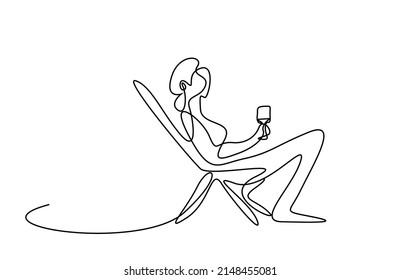 Woman sitting in relax comfortable chair with drinking glass in hand. woman sitting on sun lounger and drinking on vacation