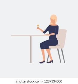 Woman sitting at table. Festive, drinking, celebration. Can be used for topics like weekend, bars, cafe