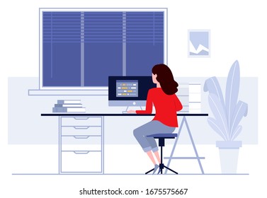 Woman sitting at table and working at home.