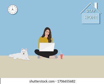 A woman sitting using a notebook in the house . The white dog sat beside. There was a character stay home on the wall