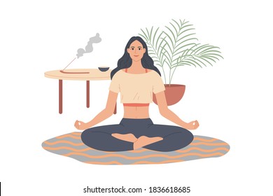 Woman sitting in yoga pose at home. Girl doing meditation in living room