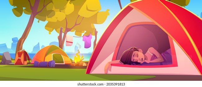 Woman sleep in camping tent with fire and tourist stuff in forest. Traveler girl relax in halt with drying clothes on nature landscape with trees and sea, hiking or travel Cartoon vector illustration