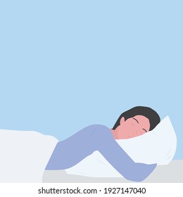 woman sleeps on a pillow on blue background