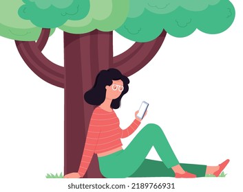 Woman with smartphone sits under tree. Girl using  smartphone to study online, makes purchases, outdoor recreation.