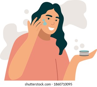 Woman smears cream face. Young woman use cosmetic to look beautiful.