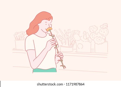 A woman smells flowers in a floral shop. hand drawn style vector design illustrations.