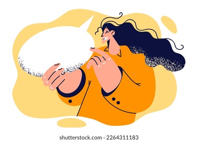 Woman smiling pointing finger at conversation bubble to recommend paying attention to messages with important information. Woman with dialogue cloud in hands pays attention to phrase or words said