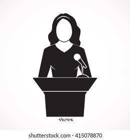 Woman Speaker Icon. Orator Speaking From Tribune Vector Flat Style Colorful Illustration