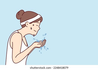 Woman with sports headband on hair holds water in palms wanting to wash face after fitness or morning jogging. Girl in T-shirt with drops of sweat on face after athletic exercises. Flat vector image 