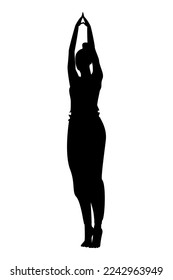 A woman in sportswear and gathered hair performs a yoga asana on tiptoe with her arms spread apart
