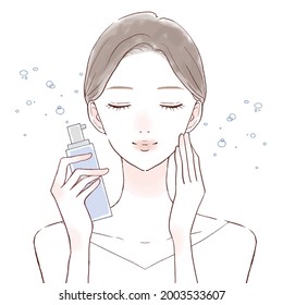 Woman sprinkled with mist type lotion on face. On a white background.