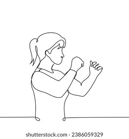 woman in a stance with fists ready for defense or attack - one line art vector. concept fighting qualities, sports wrestling, strength