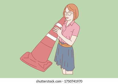 
Woman stand and holding a traffic cone instead of a megaphone.