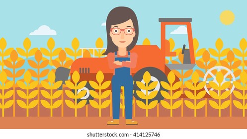 Woman standing with combine on background.