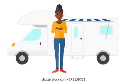 Woman standing in front of motor home.