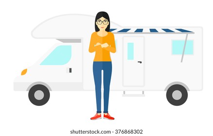 Woman standing in front of motor home.