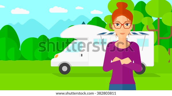 Woman standing in front\
of motor home.