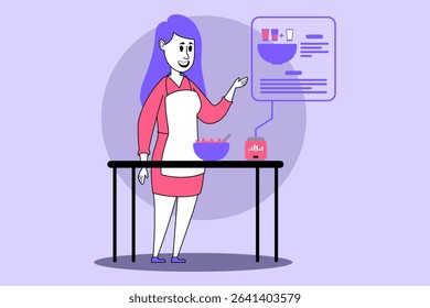 Woman standing at kitchen table with bowl of ingredients. Woman gesturing towards digital display showing recipe and nutritional information, indicating cooking process