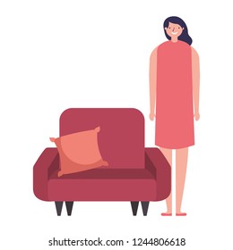 woman standing near sofa with cushion