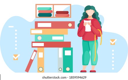 Woman standing near stack of folders preparing for measurements for future dress. Seamstress sews clothes to order for customers. Sewing workshop. Clothing marking. The girl works in the atelier