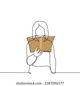 woman standing with open book at head level - one line drawing vector. concept reading a book, choosing a book