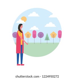 woman standing in the park with trees