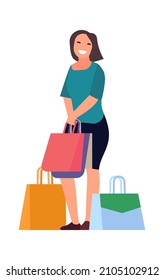 Woman standing with purchases in paper bag. Happy customer concept