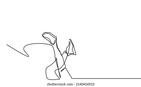 a woman is standing upside down and only her legs and sneakers are visible