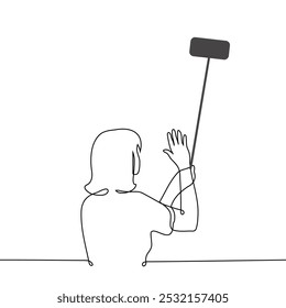 woman standing waving at camera of his phone holding it on selfie stick - one line art vector. concept vlogger or blogger making content, man communicates via video, live broadcast. Handmade vector