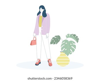 a woman standing wearing a yellow shirt and purple outerwear, wearing white trousers, long hair, carrying a handbag and she is also wearing red and black sneakers, beside her are plants