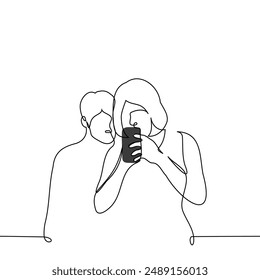 woman stands immersed in the screen of her phone and a man peeks from behind - one line art vector. concept of peeking into someone else's phone, spying and checking your partner. Handmade vector not 